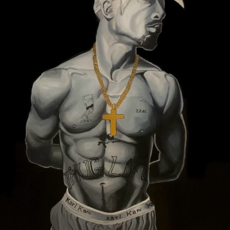 This powerful artwork portrays a sculpted figure of Tupac Shakur, blending realism with a monochromatic style. The iconic "Thug Life" tattoo and gold chain contrast against the black background, highlighting his enduring legacy in both music and culture. It’s a tribute to Tupac's influence, symbolizing strength, resilience, and the lasting impact of his words and persona.